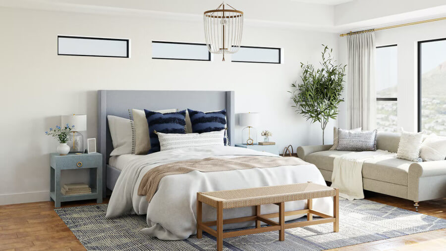 Bedroom with neutral colors on the bed and sofa and wall