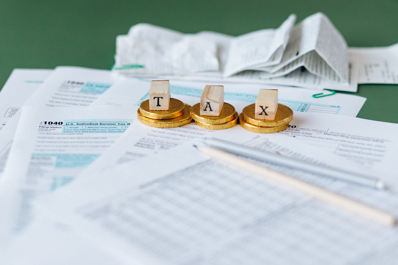 Teh word tax on top of coins, on top paperwork