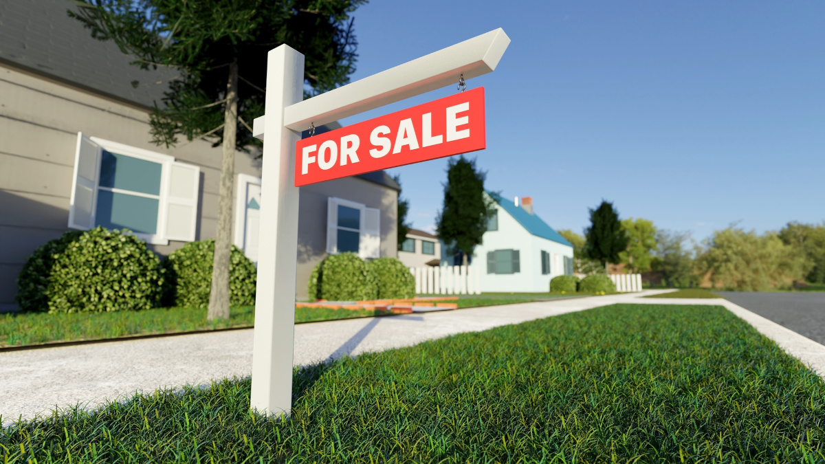 For sale sign in front of a house